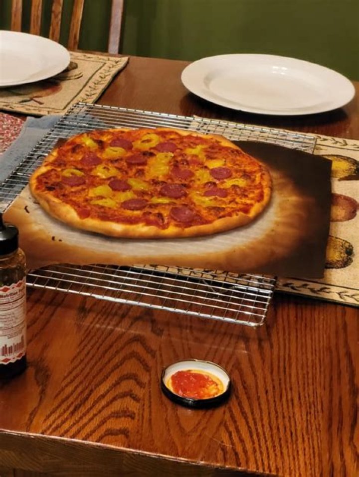 Can I use parchment paper on pizza stone?