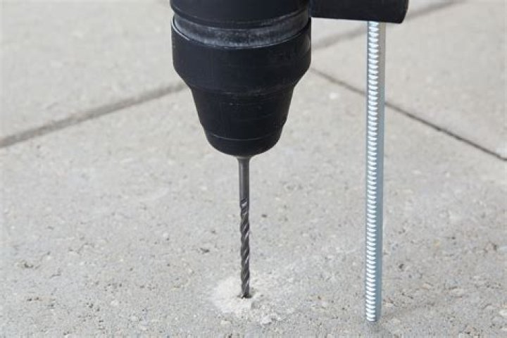 Can you drill into concrete without a hammer drill?