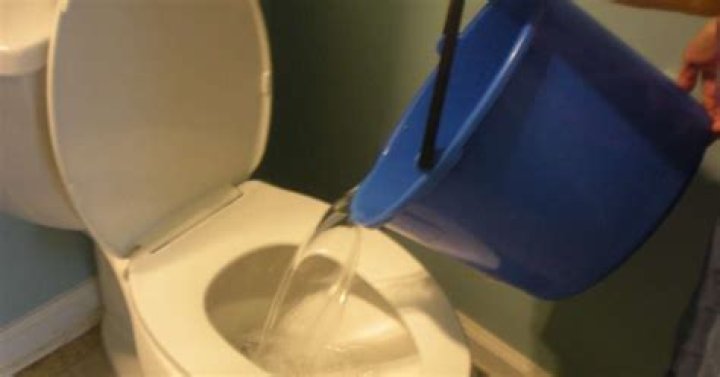 Can you flush poop with a bucket of water?