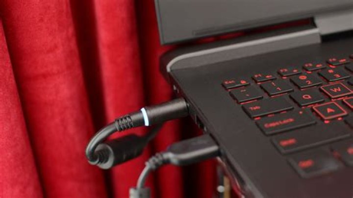 Does leaving a laptop charger plugged in use electricity?