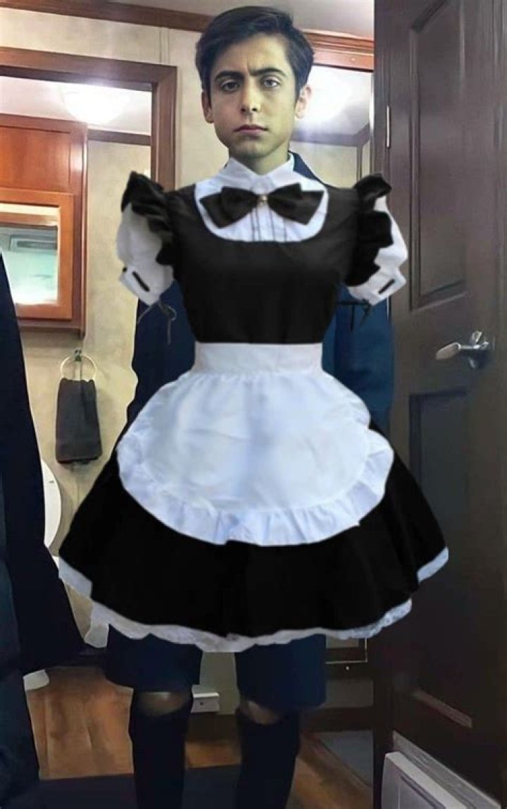 Why does Raymond wear a maid outfit?